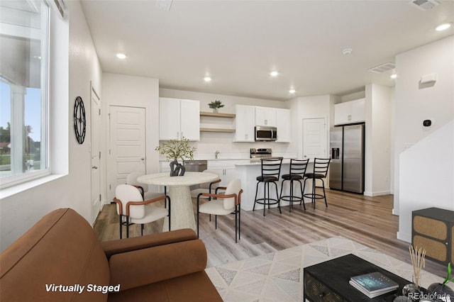 503 S Rollie Ave Unit 13C, Fort Lupton, CO 80621 - living area with recessed lighting and light wood-style flooring
