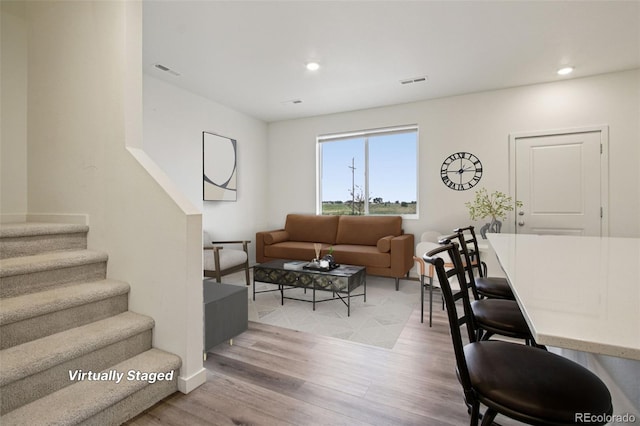 503 S Rollie Ave Unit 13C, Fort Lupton, CO 80621 - living room with wood finished floors, stairs, and recessed lighting