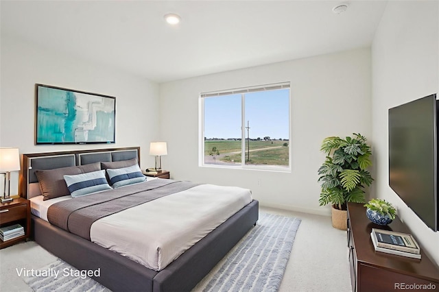 503 S Rollie Ave Unit 13C, Fort Lupton, CO 80621 - bedroom featuring light carpet and baseboards
