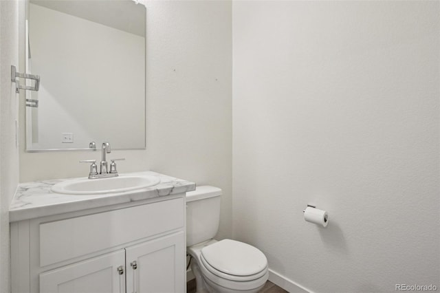 503 S Rollie Ave Unit 13C, Fort Lupton, CO 80621 - half bathroom with vanity and toilet
