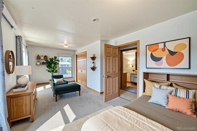 410 W 16th St, Salida, CO 81201 - bedroom with baseboards, ensuite bathroom, a closet, and light colored carpet