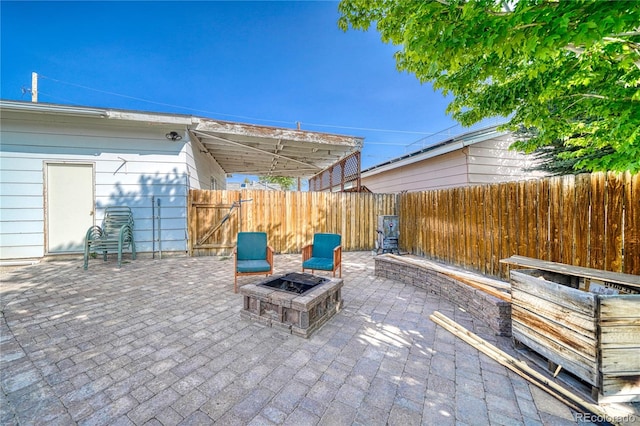 410 W 16th St, Salida, CO 81201 - fenced backyard featuring an outdoor fire pit, a patio area, and a gate