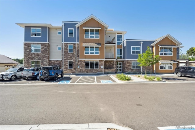290 S Cherrywood Dr Unit 202, Lafayette, CO 80026 - view of property featuring uncovered parking
