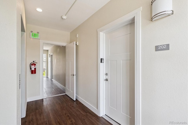 290 S Cherrywood Dr Unit 202, Lafayette, CO 80026 - corridor featuring dark wood-style floors and baseboards