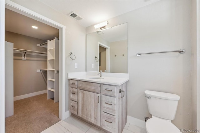 290 S Cherrywood Dr Unit 202, Lafayette, CO 80026 - bathroom featuring vanity and a walk in closet