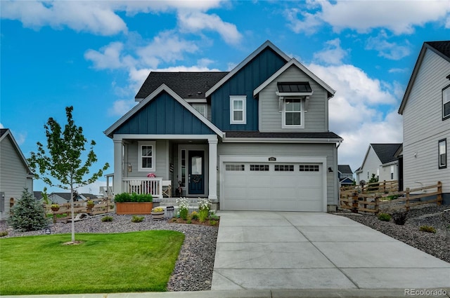 craftsman-style home with covered porch, a garage, and a front lawn