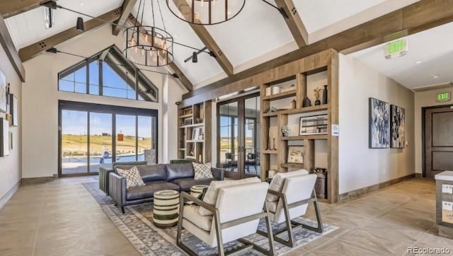 living room with beam ceiling, high vaulted ceiling, and french doors