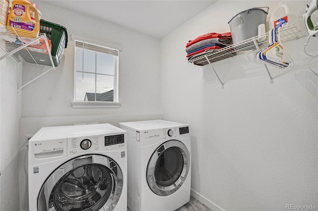 washroom with washing machine and dryer