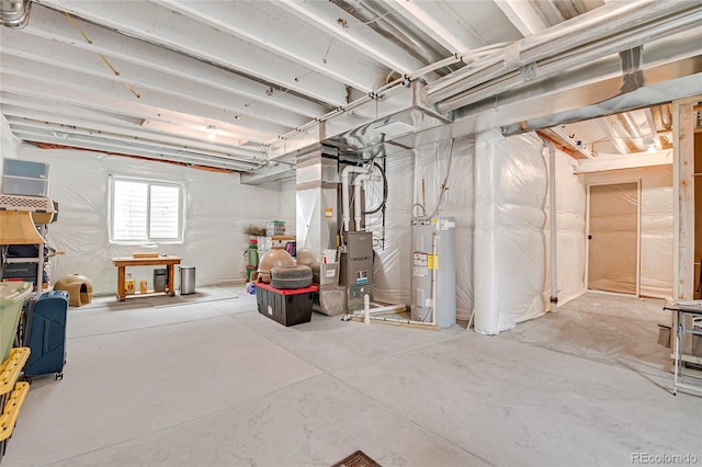 basement with electric water heater and heating unit