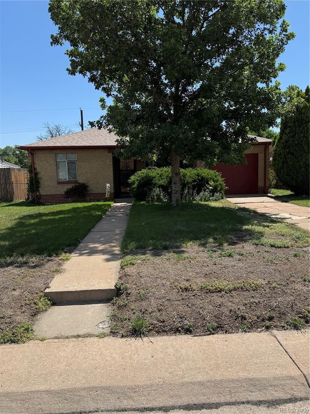 460 Yates St, Denver, CO 80204 - view of front of property with brick siding and an attached garage