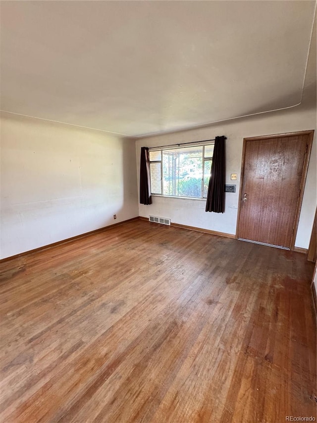 460 Yates St, Denver, CO 80204 - unfurnished room featuring wood finished floors and baseboards
