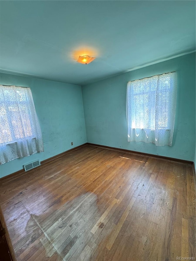 460 Yates St, Denver, CO 80204 - unfurnished room with plenty of natural light and hardwood / wood-style floors
