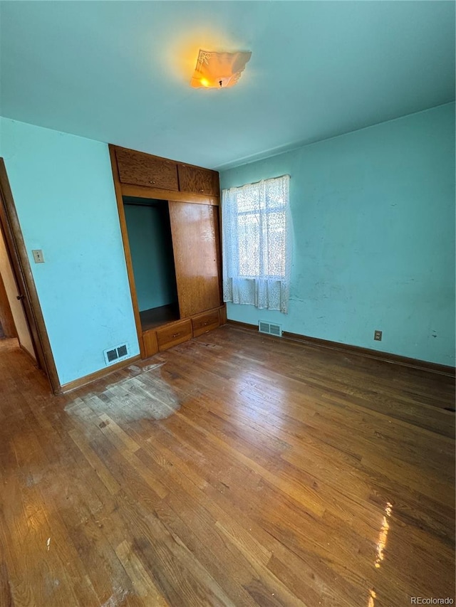 460 Yates St, Denver, CO 80204 - unfurnished bedroom featuring wood finished floors and a closet