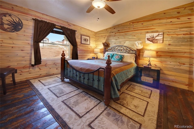 bedroom with wood-type flooring, ceiling fan, lofted ceiling, and wood walls