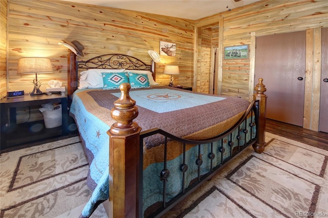 bedroom with wood walls