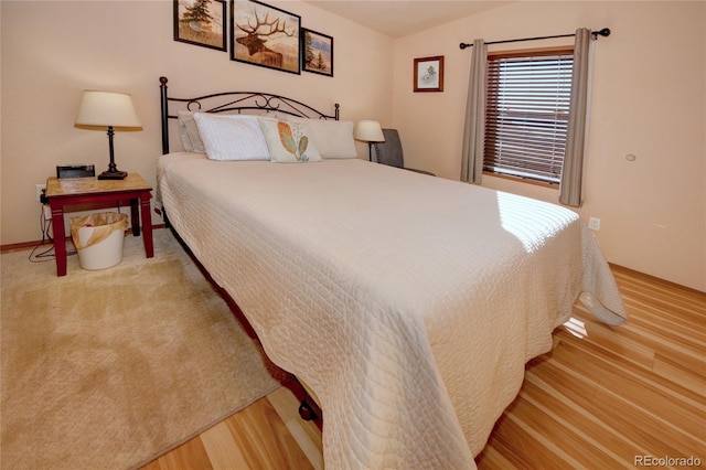 bedroom with wood-type flooring