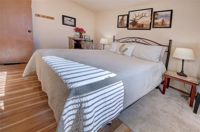 bedroom with light hardwood / wood-style flooring