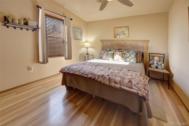 bedroom featuring ceiling fan and light hardwood / wood-style floors