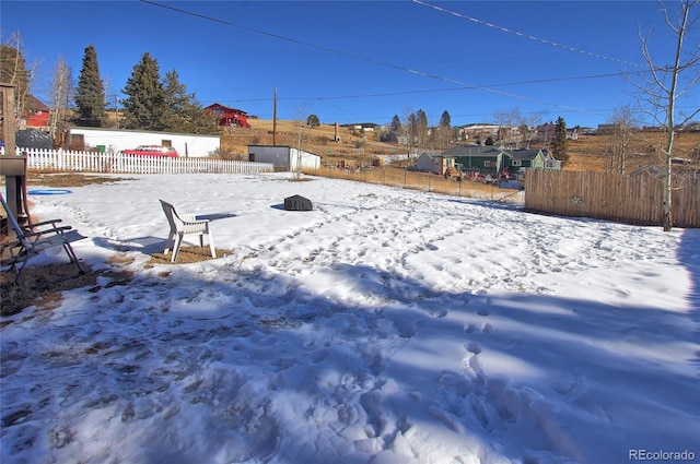 view of yard covered in snow