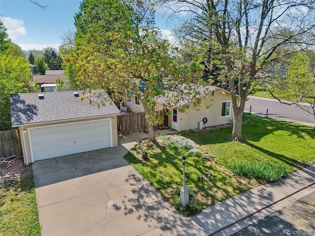 view of front of house with a garage, driveway, and a shingled roof