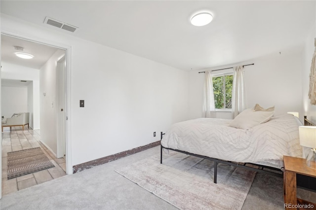 carpeted bedroom with baseboards