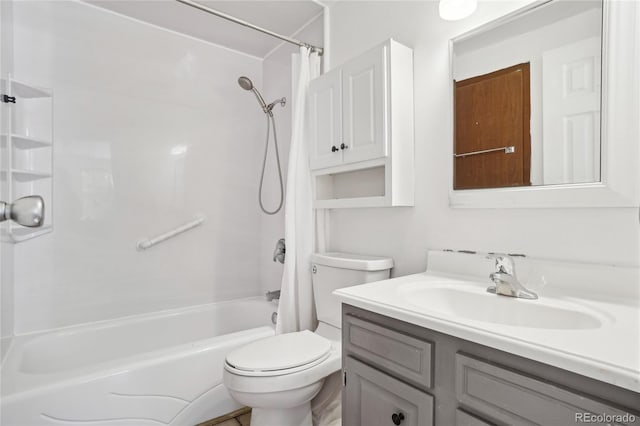full bath with toilet, vanity, and shower / bath combo with shower curtain
