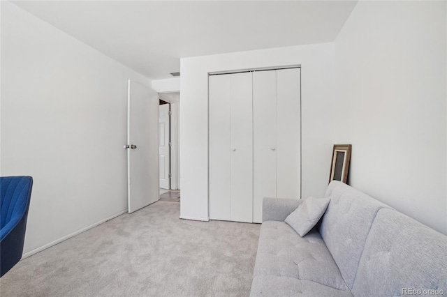 living area featuring carpet floors