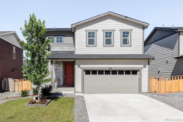 6117 Easton Cir, Frederick, CO 80504 - view of front of house featuring driveway, a garage, and stone siding
