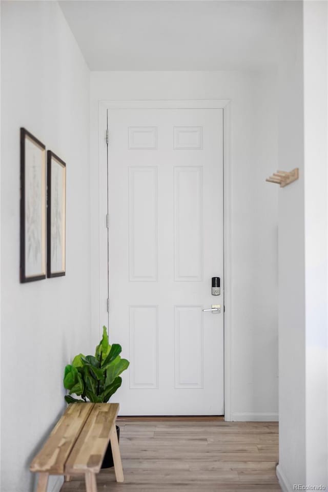 6117 Easton Cir, Frederick, CO 80504 - doorway with light wood-type flooring and baseboards