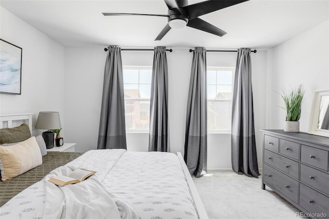 6117 Easton Cir, Frederick, CO 80504 - bedroom featuring multiple windows, light colored carpet, and a ceiling fan