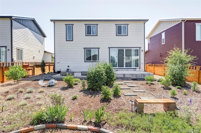 6117 Easton Cir, Frederick, CO 80504 - back of property with a fenced backyard and a patio