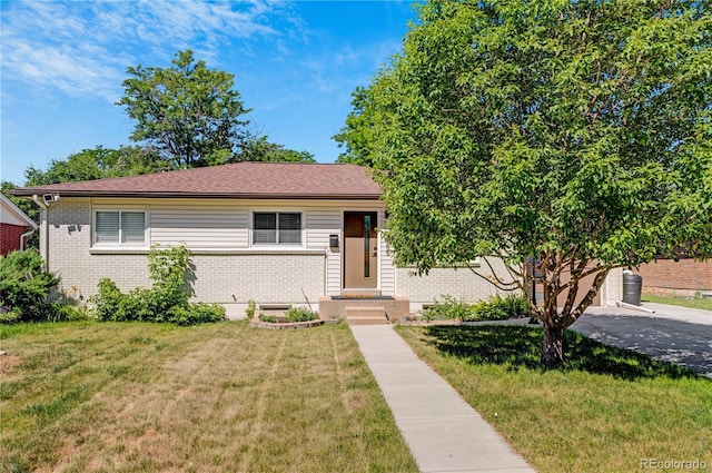 3055 S Winona Ct, Denver, CO 80236 - view of front of house with brick siding and a front lawn
