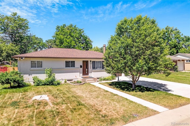 3055 S Winona Ct, Denver, CO 80236 - ranch-style home featuring brick siding and a front lawn