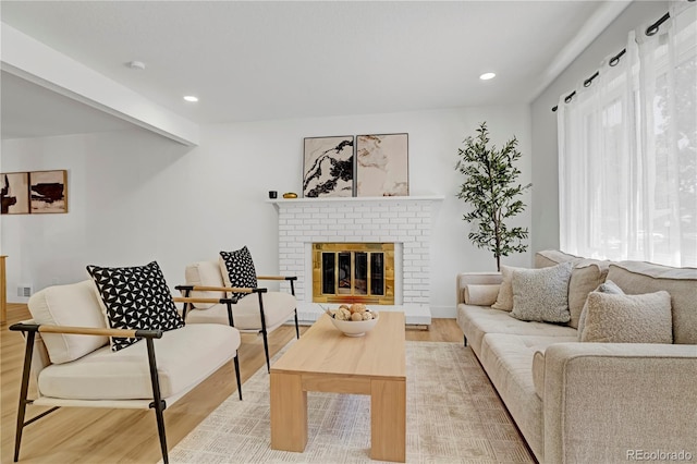 3055 S Winona Ct, Denver, CO 80236 - living room featuring light wood-style floors, a fireplace, and recessed lighting