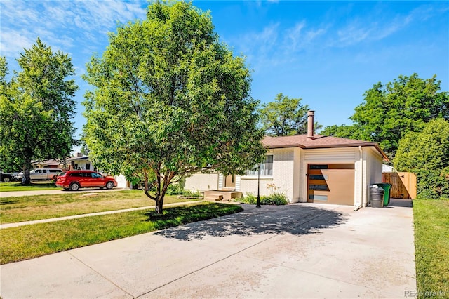 3055 S Winona Ct, Denver, CO 80236 - view of front of home featuring driveway and an attached garage