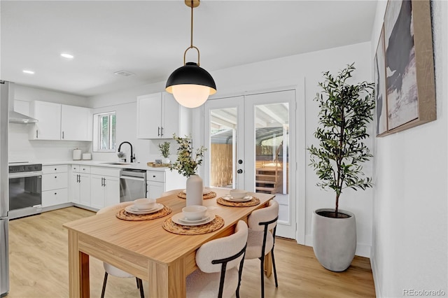 3055 S Winona Ct, Denver, CO 80236 - dining space with light wood-style flooring, french doors, and recessed lighting