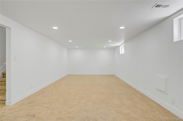 3055 S Winona Ct, Denver, CO 80236 - below grade area with light carpet, stairs, and recessed lighting