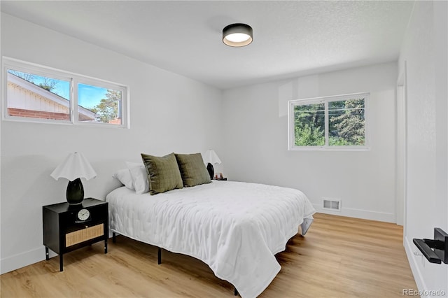 3055 S Winona Ct, Denver, CO 80236 - bedroom with light wood-style flooring