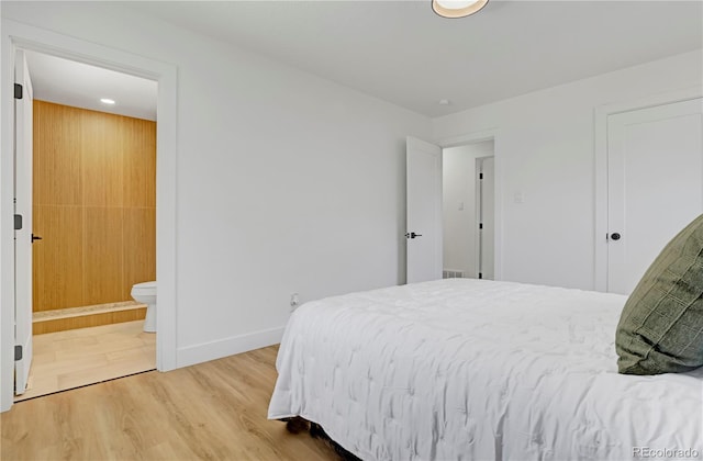 3055 S Winona Ct, Denver, CO 80236 - bedroom featuring wood finished floors and ensuite bathroom