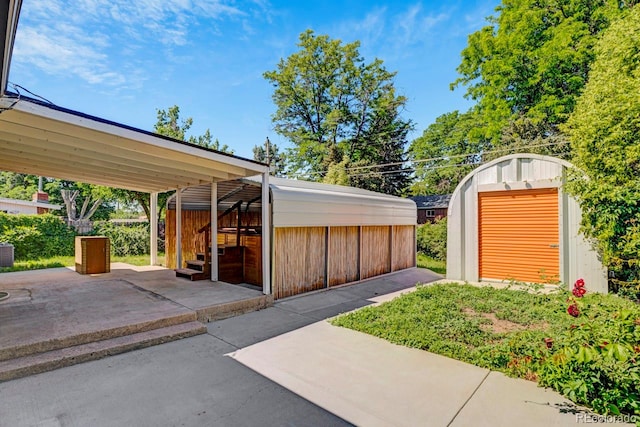 3055 S Winona Ct, Denver, CO 80236 - garage featuring a storage shed