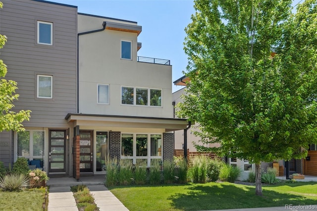 2730 Hooker St, Denver, CO 80211 - view of front facade featuring a front yard and stucco siding