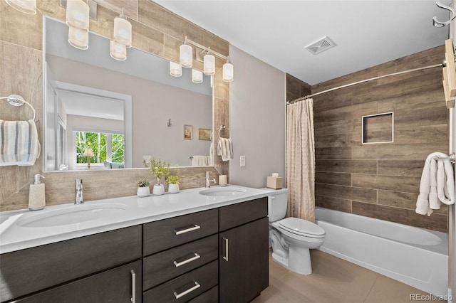 2730 Hooker St, Denver, CO 80211 - full bathroom with tile patterned floors, double vanity, and shower / tub combo with curtain