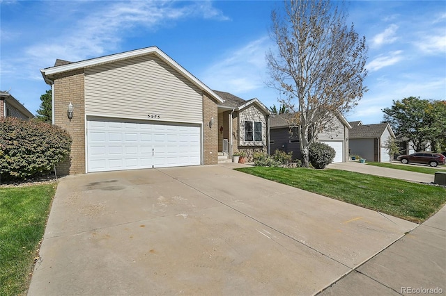 5275 W 9th Street Dr, Greeley, CO 80634 - ranch-style home featuring brick siding, concrete driveway, a front lawn, and a garage