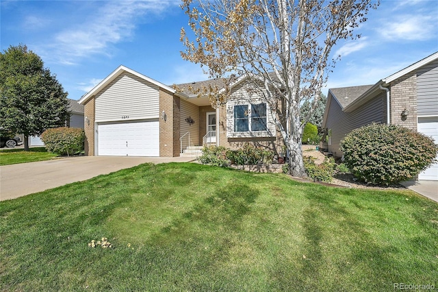 5275 W 9th Street Dr, Greeley, CO 80634 - view of front of property featuring brick siding, a garage, driveway, and a front lawn