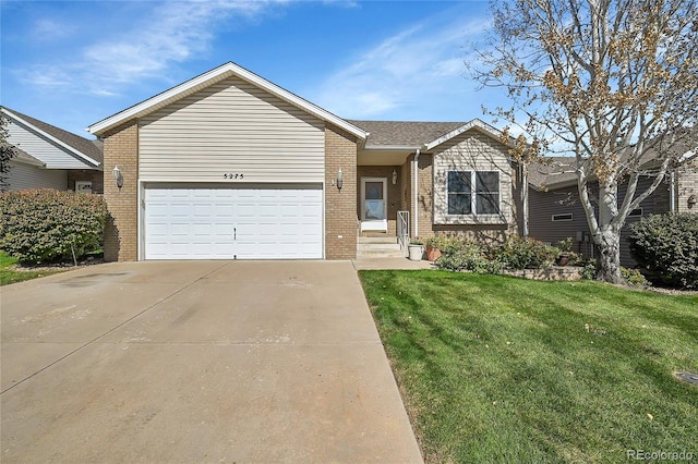 view of front of property featuring a garage and a front lawn