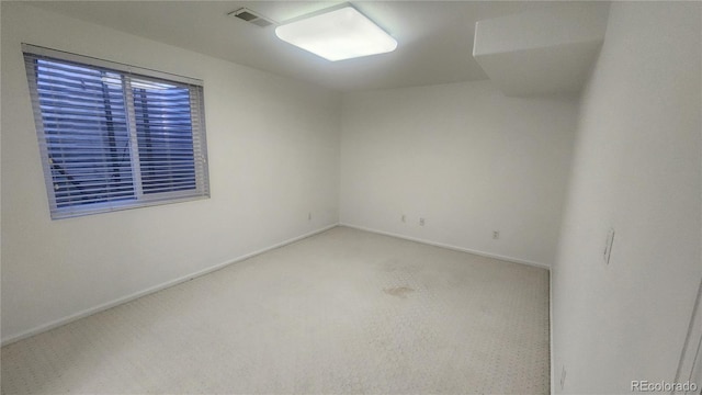 unfurnished room featuring carpet flooring