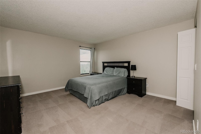 431 Wright St Unit 203, Lakewood, CO 80228 - carpeted bedroom featuring baseboards and a textured ceiling