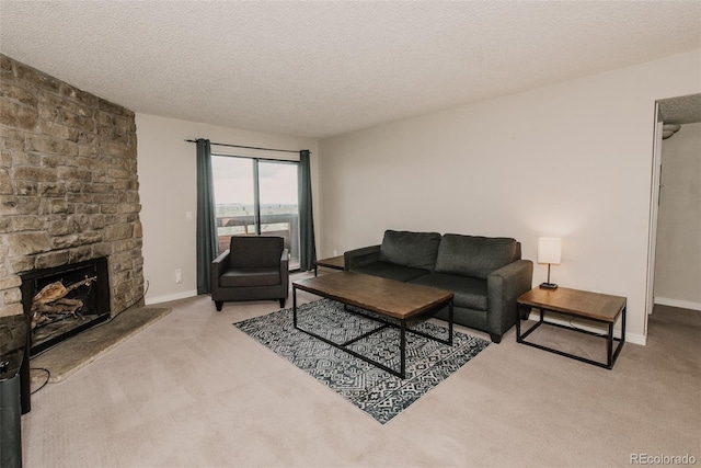 431 Wright St Unit 203, Lakewood, CO 80228 - carpeted living room with baseboards, a textured ceiling, and a fireplace
