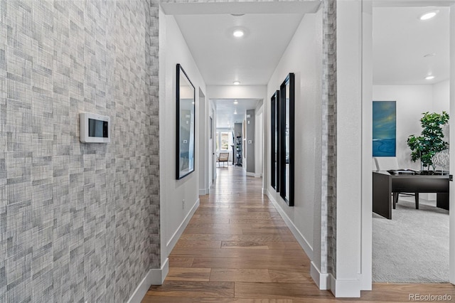 16554 W 93rd Way, Arvada, CO 80007 - hall featuring wood finished floors and recessed lighting