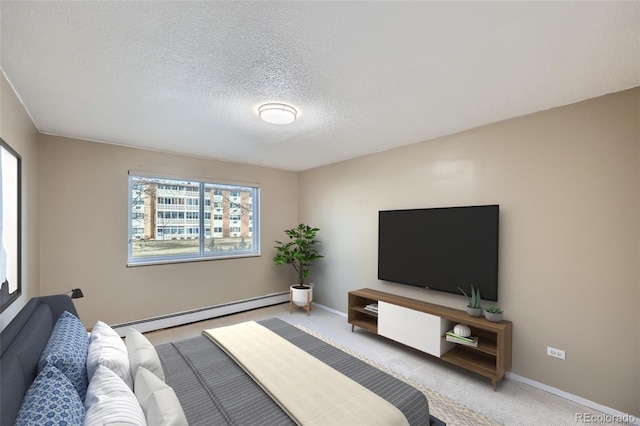 carpeted bedroom with a baseboard radiator and a textured ceiling